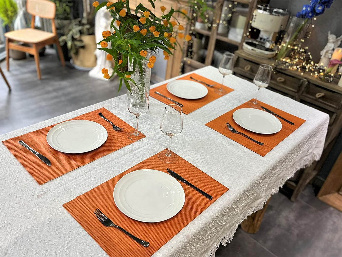 ANDSTAR Non-Slip Waterproof Placemats Set of 6 - Reusable Wipeable Table Mats for Dining Table, Kitchen, Outdoor Picnic, 12x18 Inch PVC Backed Heat Resistant Place Mats Dishwasher Safe(Orange)